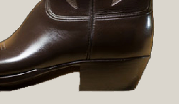 Close-up of a dark brown leather boot showing the heel.