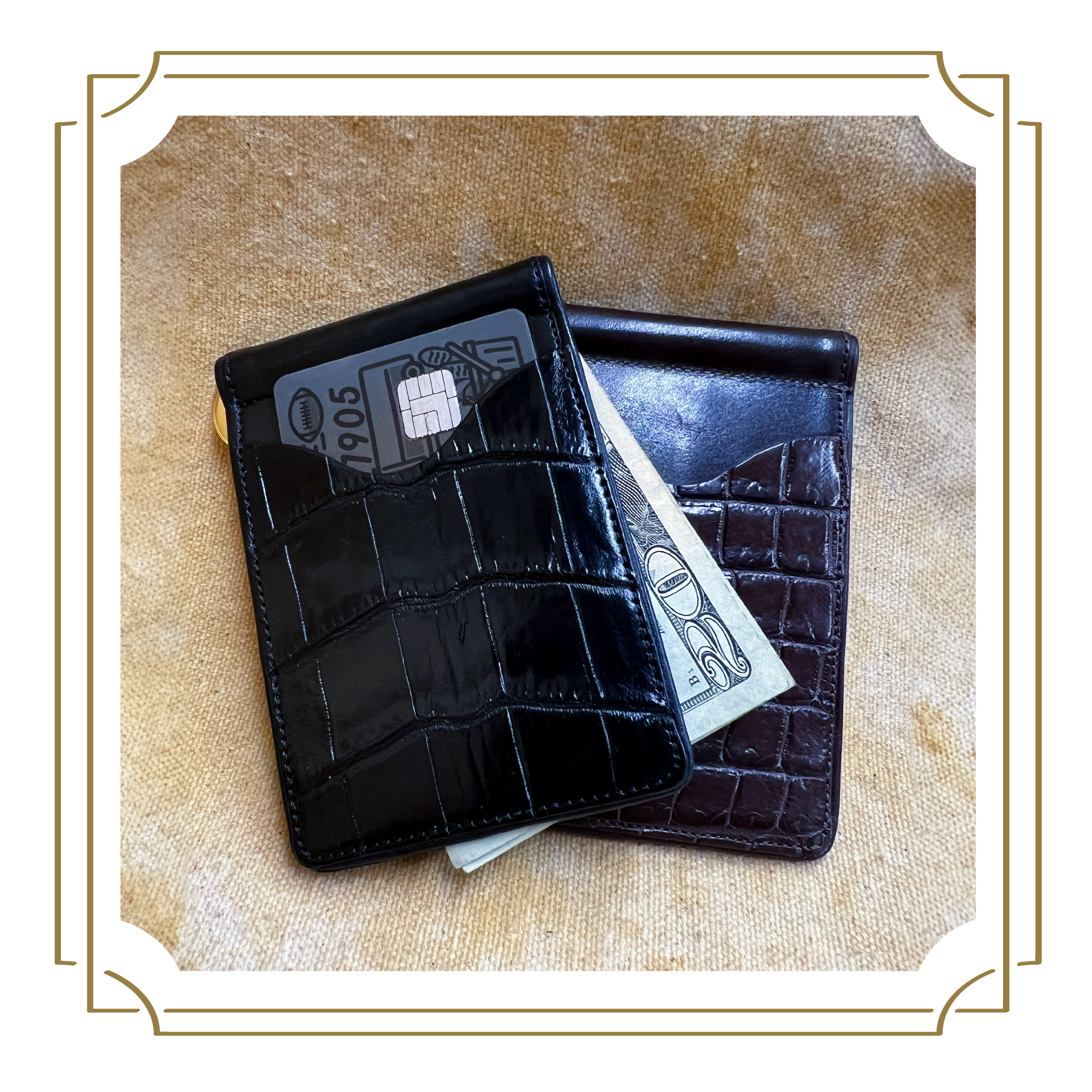 Two leather wallets, one black and one dark brown, laying on a light brown textured surface.