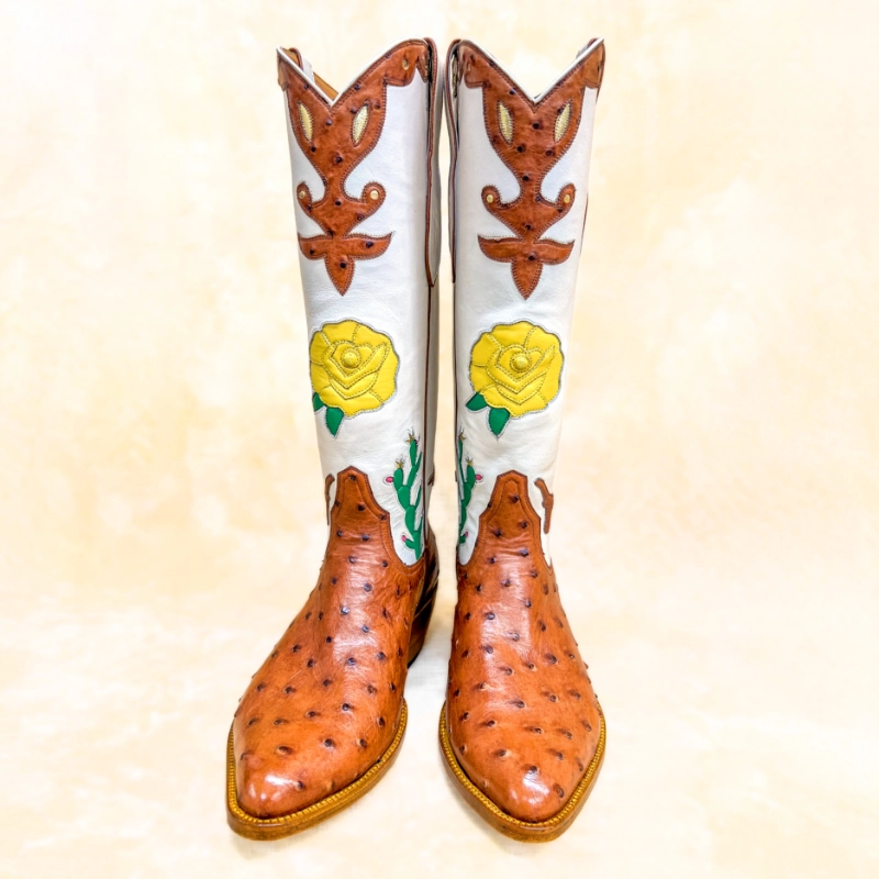 Artisan full-quill ostrich cowboy boots with floral inlays and a tall white shaft, designed for San Antonio Fiesta.