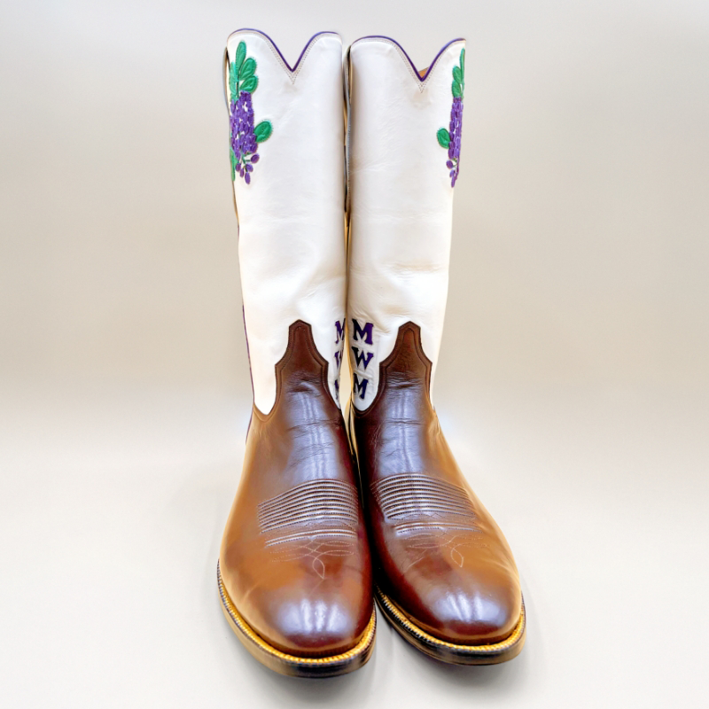 Handcrafted kangaroo leather boots featuring a tall white shaft with floral embroidery and a personalized monogram by Little's Boot Company.