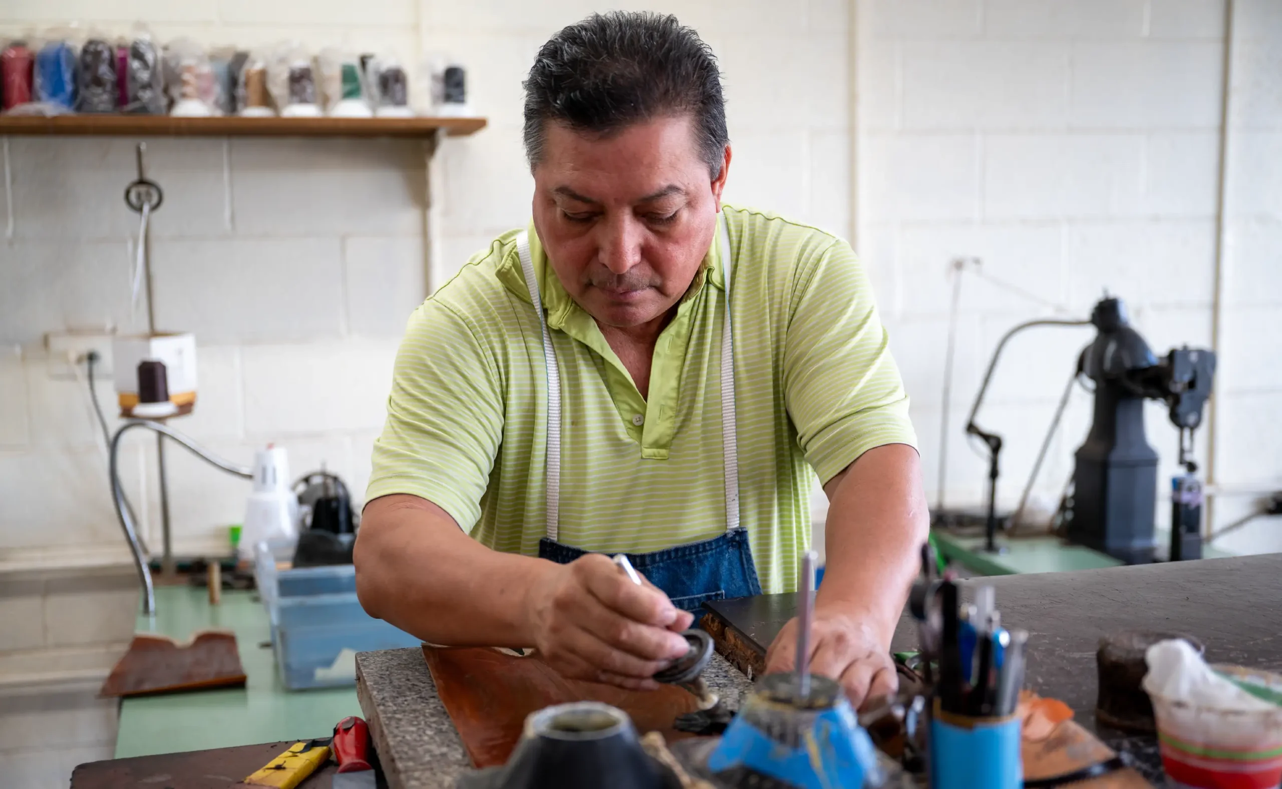 Man working on on custom boots in San Antonio.