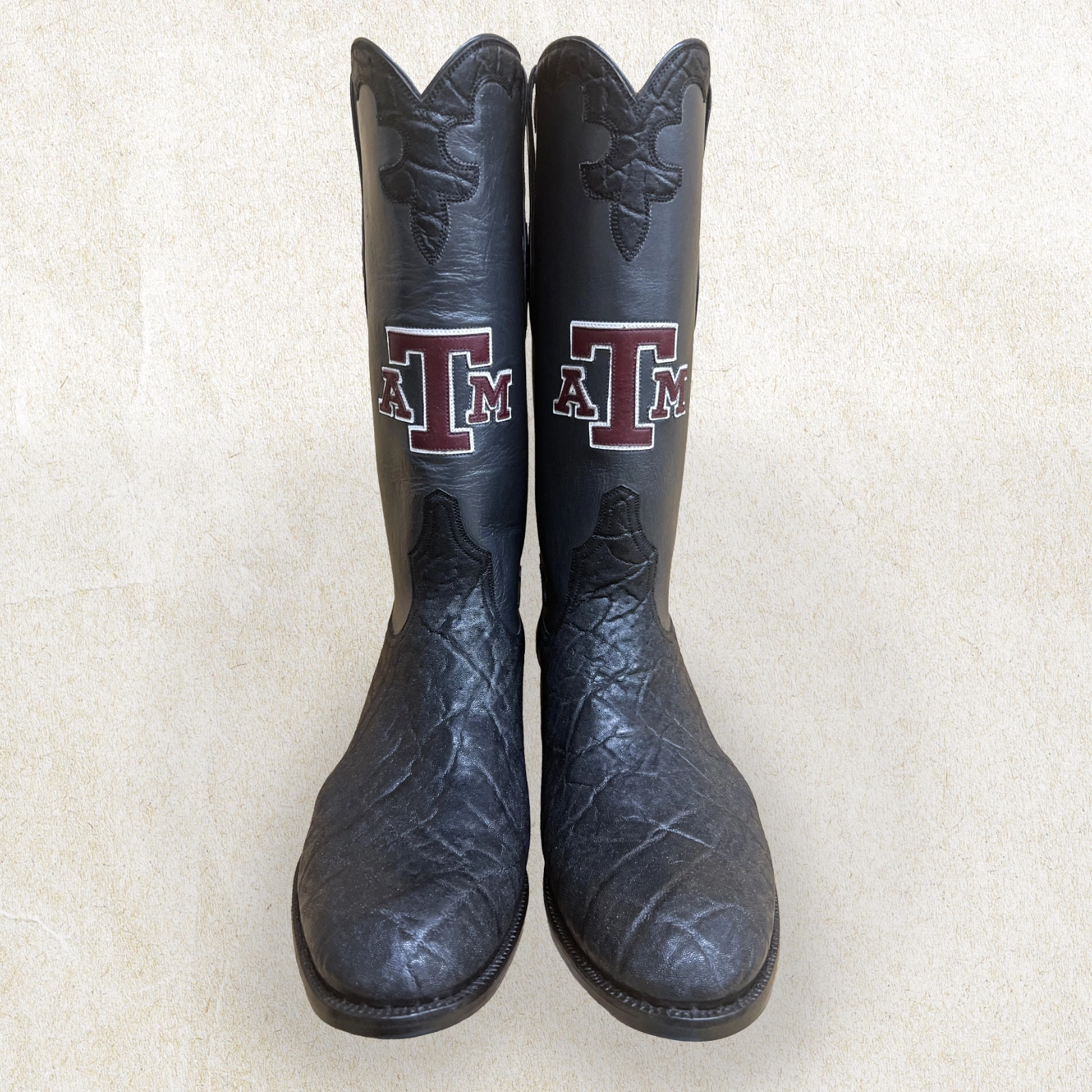 Handcrafted by Little’s Boot Company, these black cowboy boots feature bold Texas A&M detailing and custom Western character.