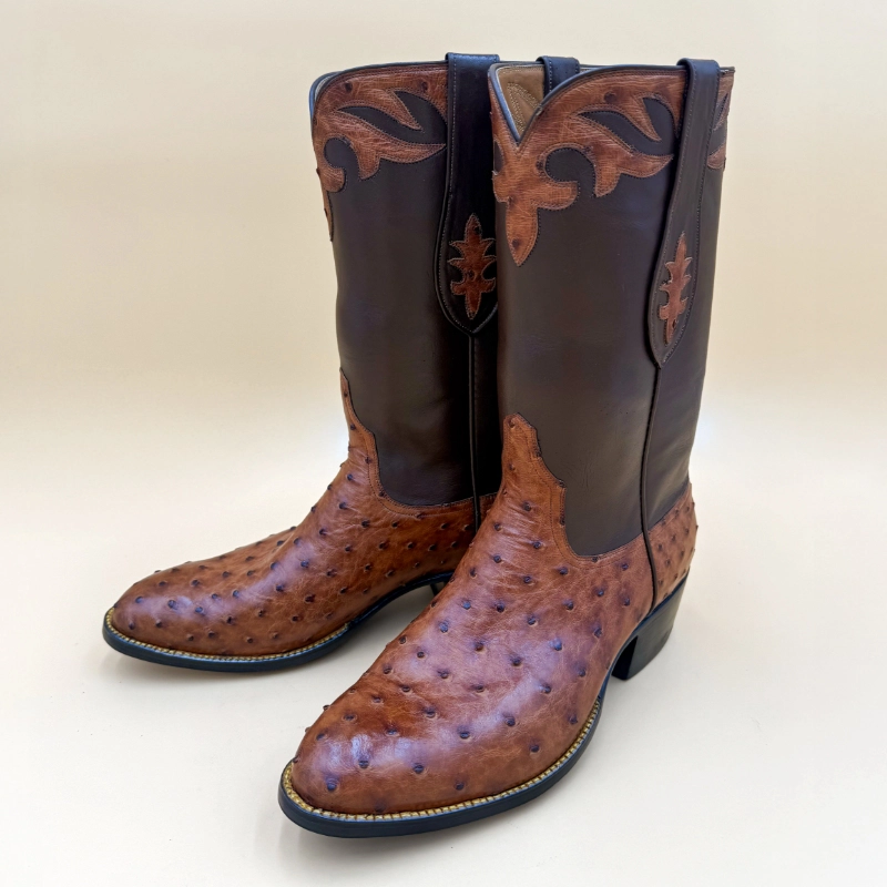 Handcrafted ostrich cowboy boots featuring a rich full-quill foot, dark leather shaft, and timeless craftsmanship by Little's Boot Co.