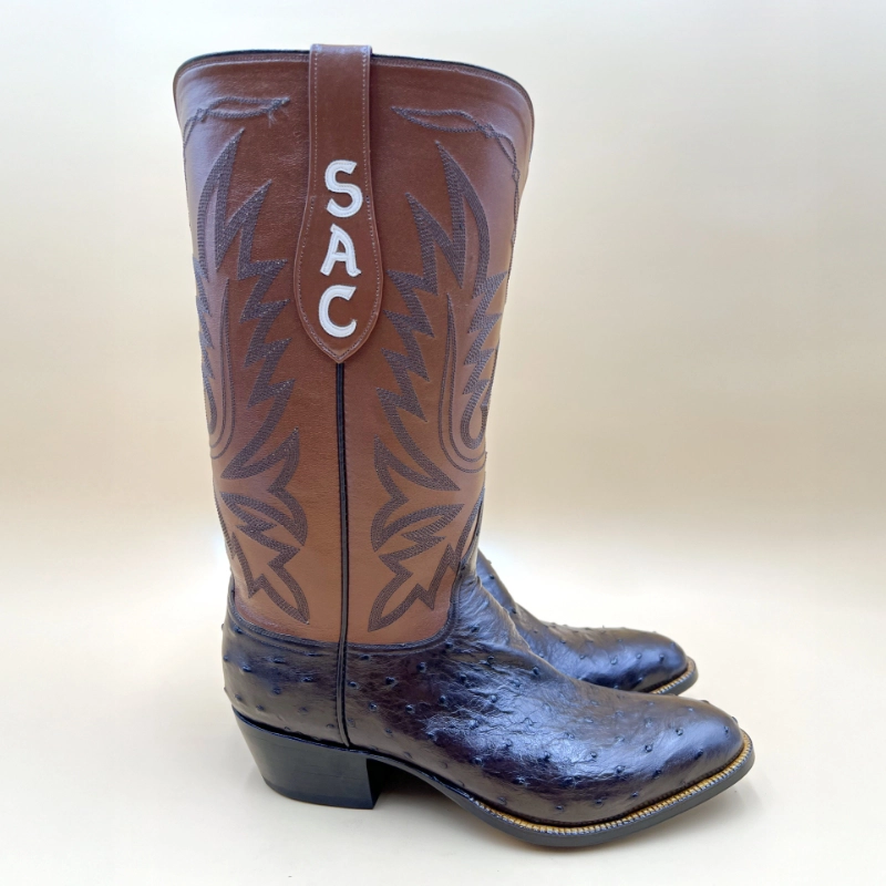 Handcrafted ostrich cowboy boots featuring a rich full-quill foot and tall leather shaft with custom monogram by Little's Boot Co.
