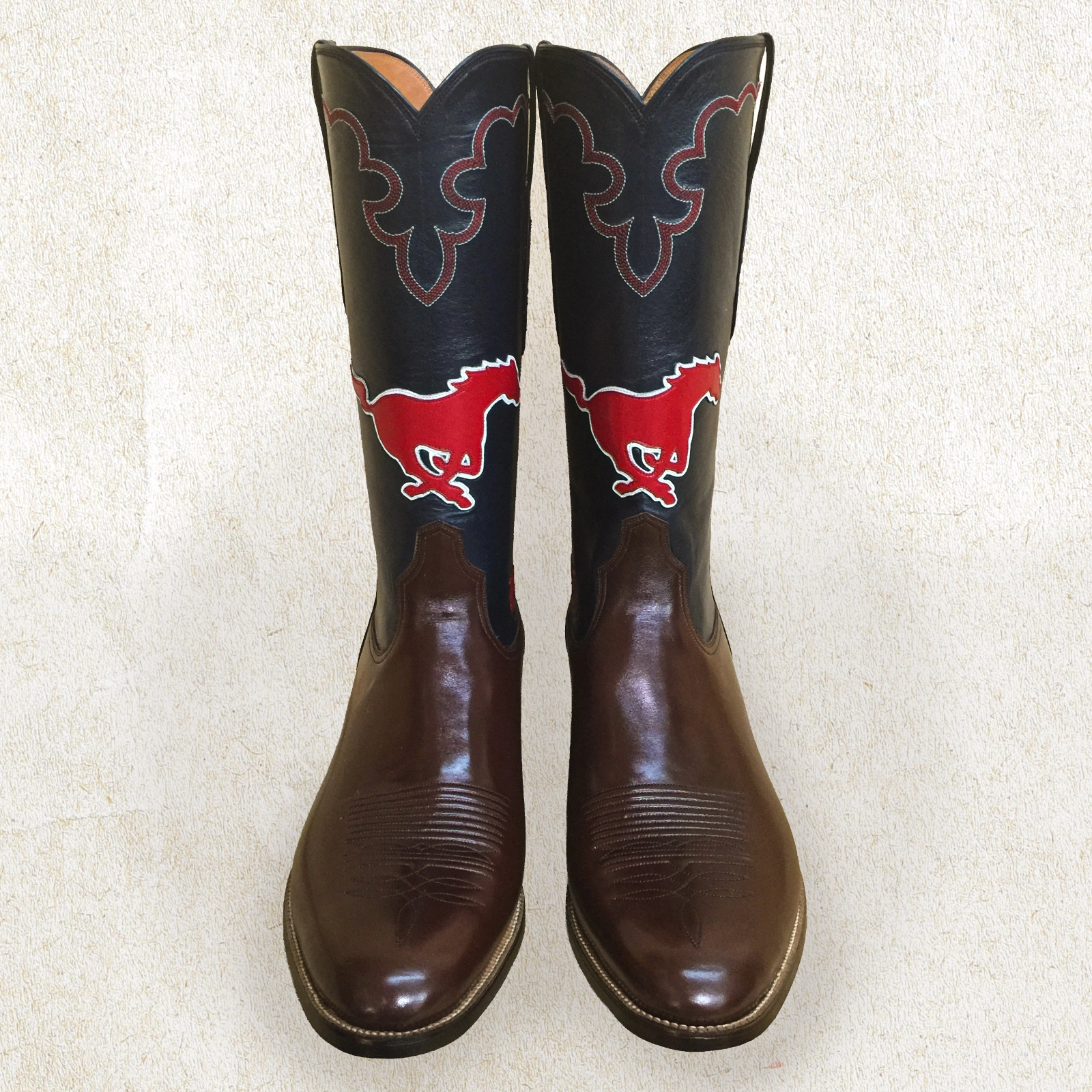 Custom SMU Mustangs boots by Little’s Boot Company, featuring bold red pony inlays and handcrafted Western stitching.